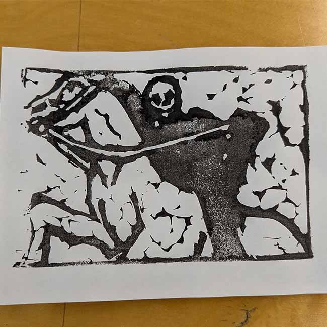 Card with a skeleton in armor on a horse on it.